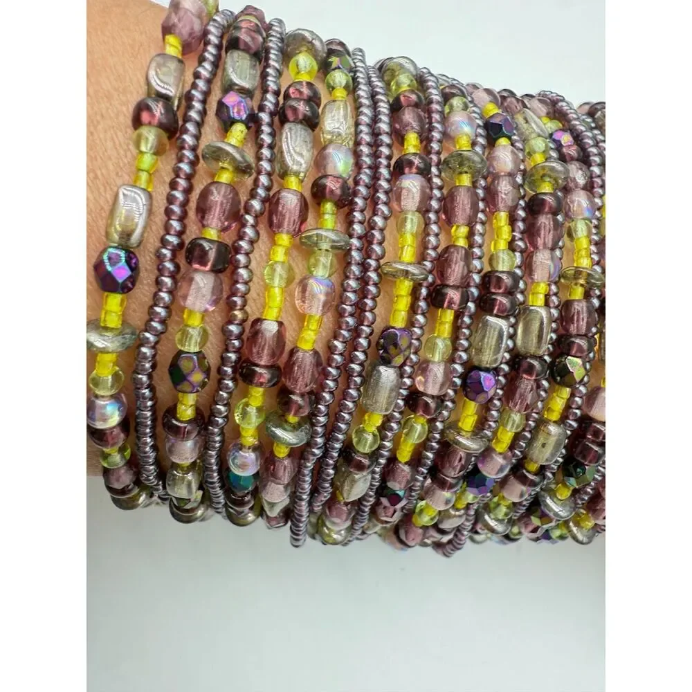 cuff 22 strand purple/green bracelet